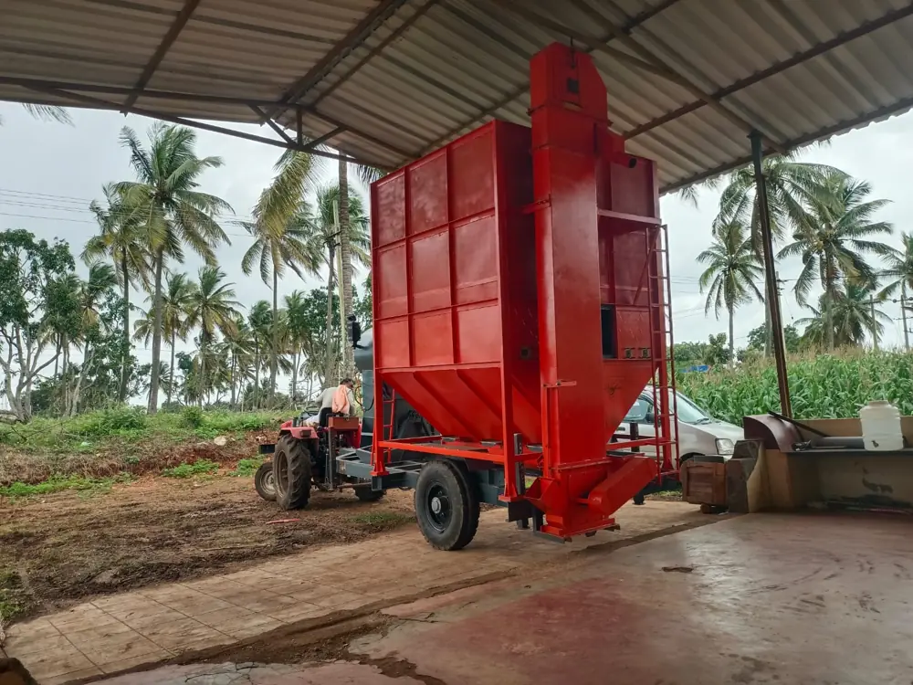 Shomas Tractor Operated Mobile Grain Dryer at a coconut farm with a tractor